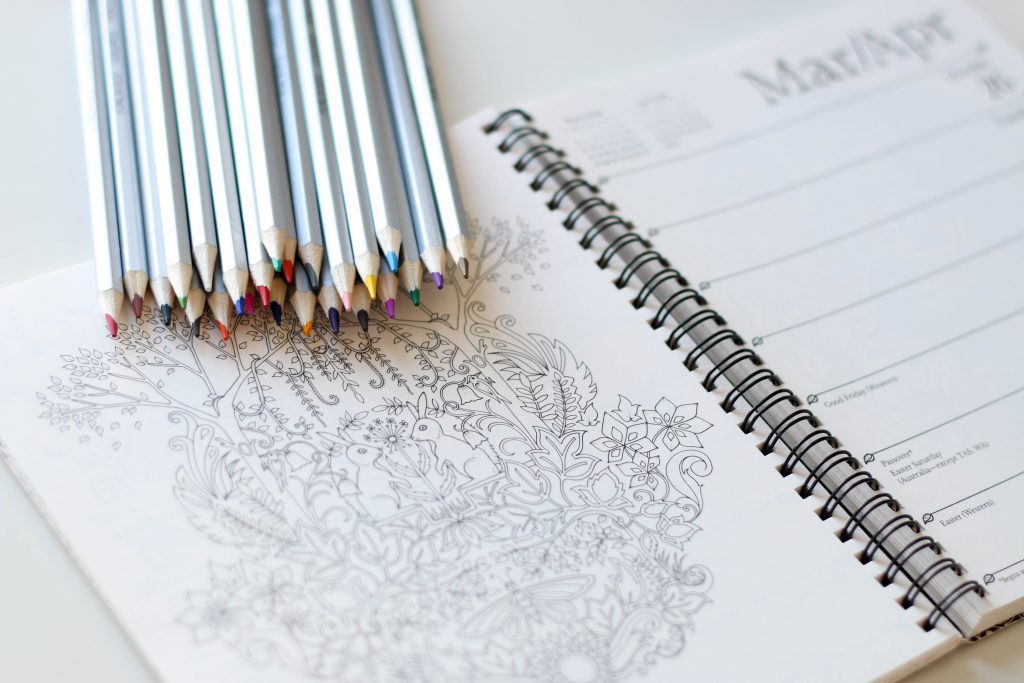 color pencil crayons on adult coloring book calendar
