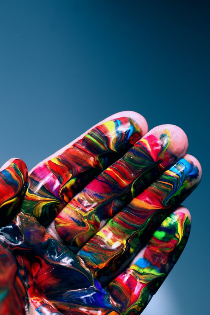 messy paint on hand art therapy